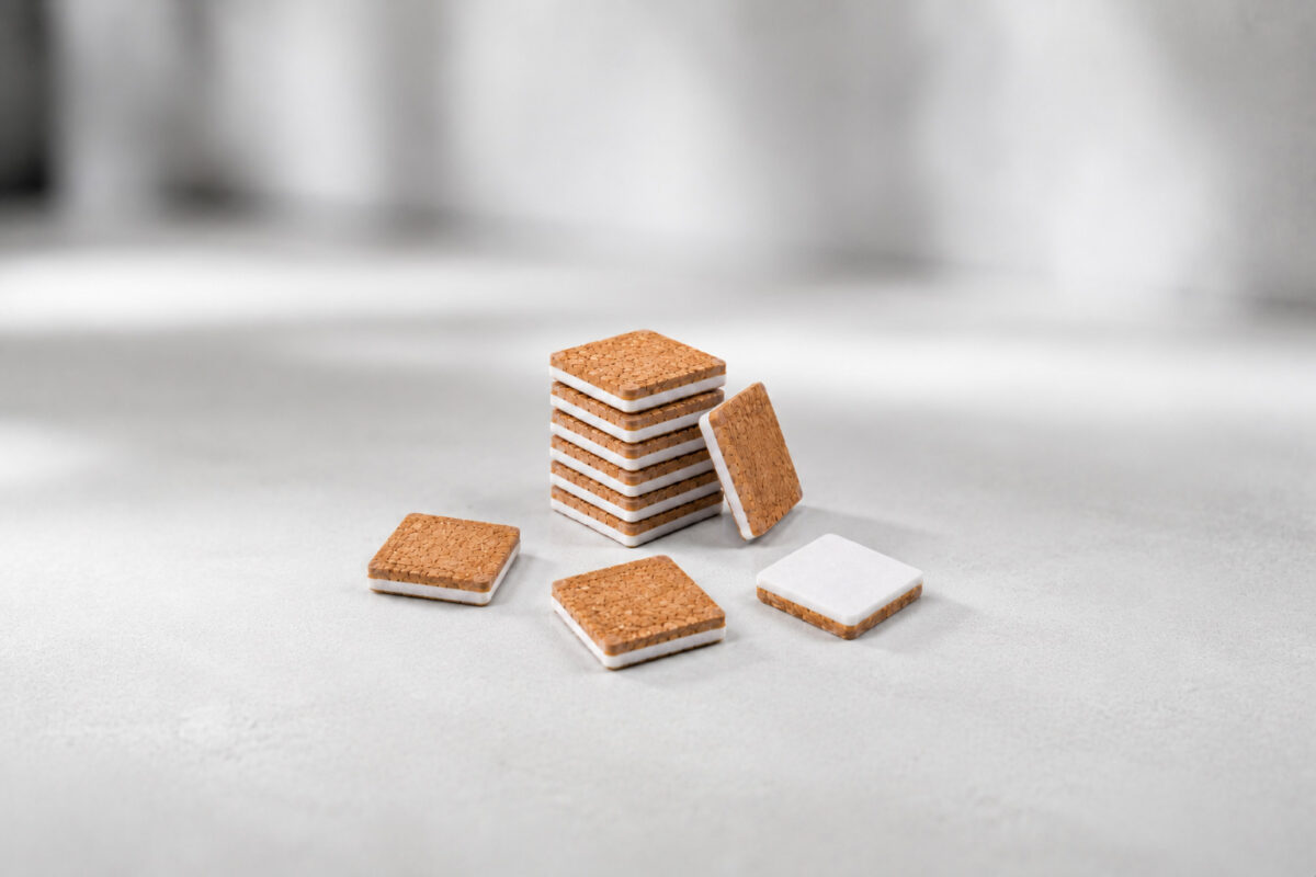 Cork stacking discs with adhesive foam for surface protection